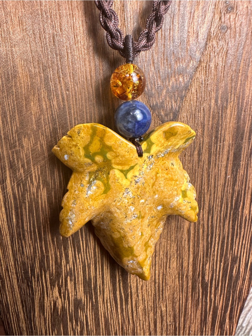 Yellow Ocean Jasper Leaf Carving Pendant Necklace on Brown Braided Rope - Picture 11 of 13